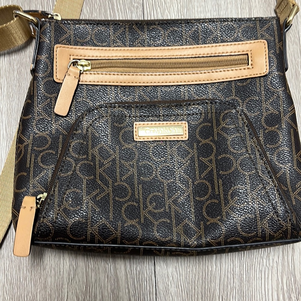 Dark brown Calvin Klein purse with long adjustable strap
